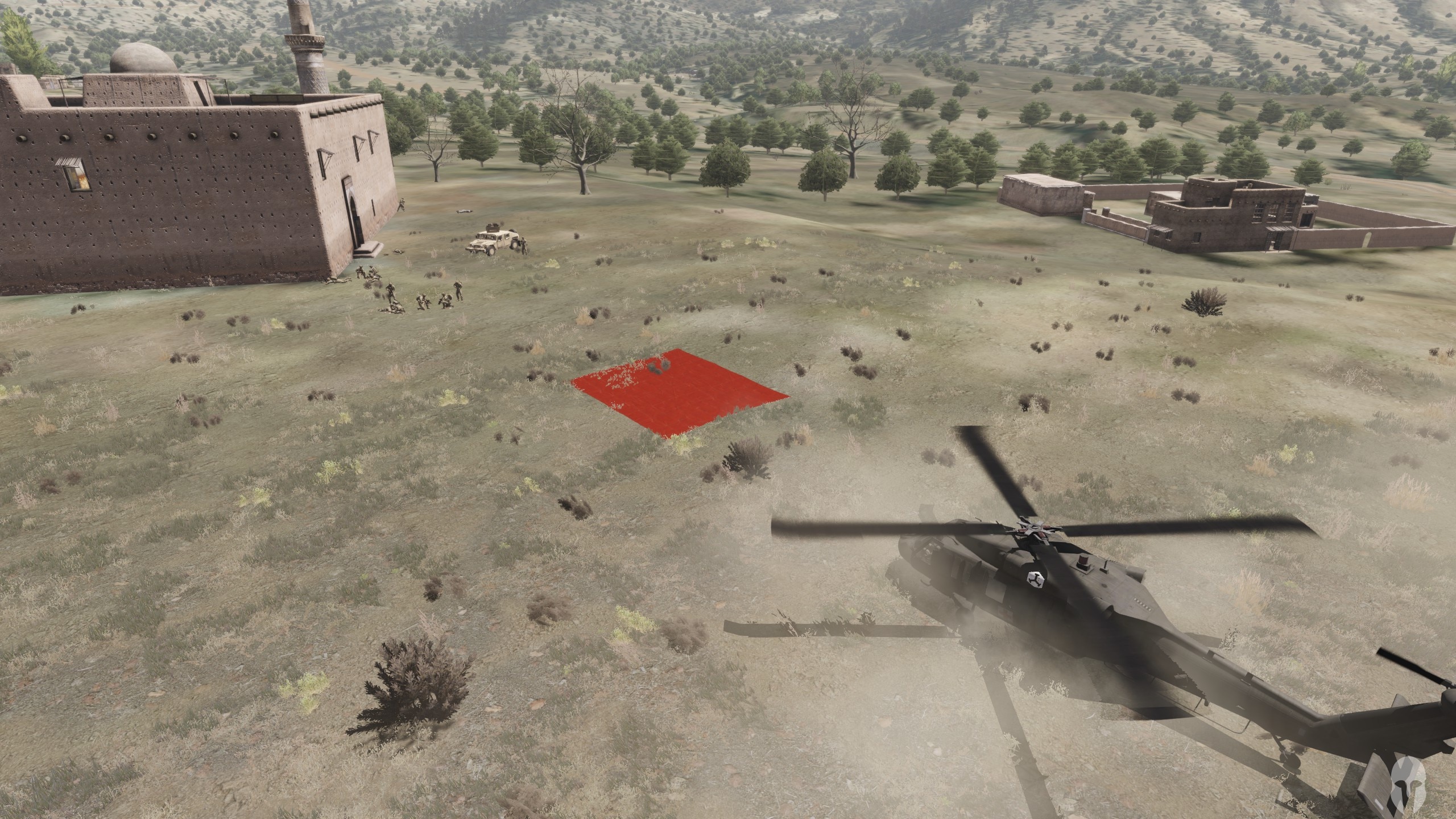Example Image of a Helicopter landing near a group soldiers that marked their position with a red signaling tarp.
